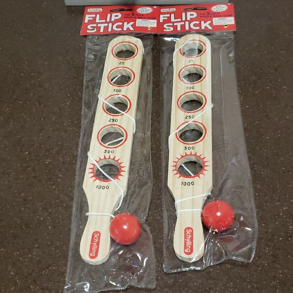 2 X Schilling Flip Stick- the 5 hole paddle ball game